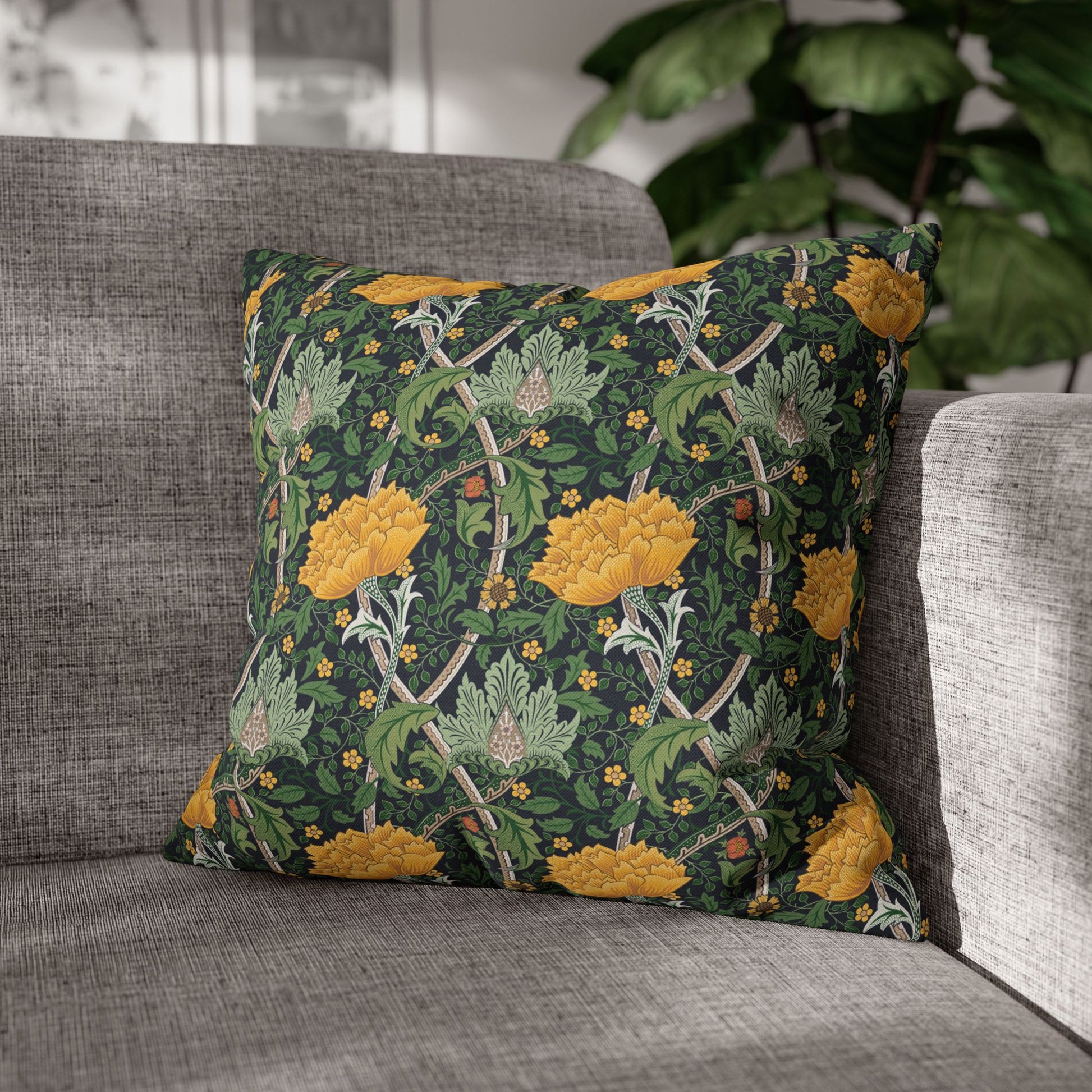 Decorative pillow with floral pattern on a gray sofa