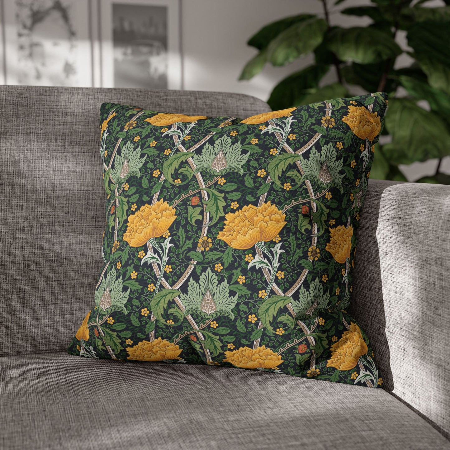 Decorative pillow with floral pattern on a gray sofa