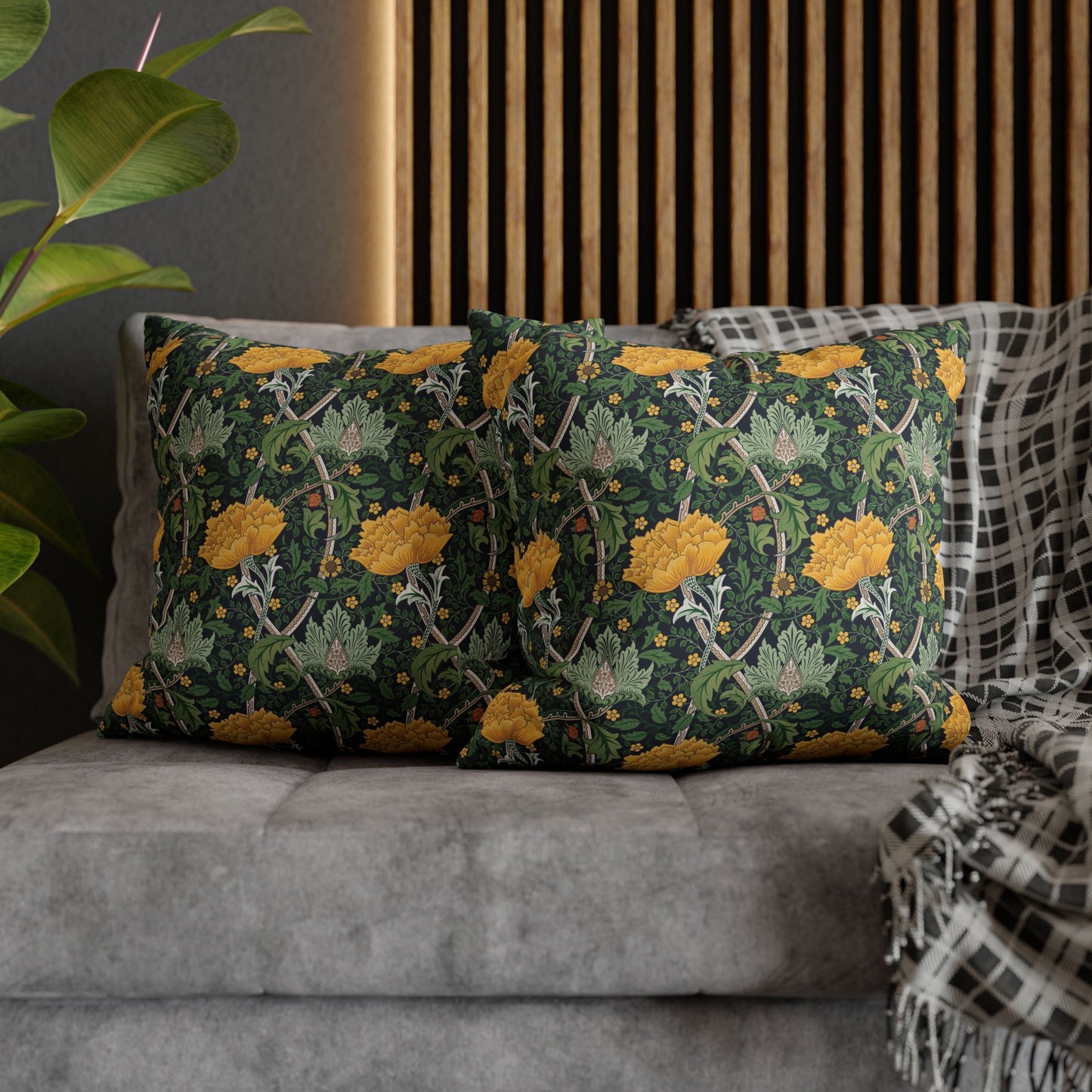 Decorative pillows with floral pattern on a gray sofa