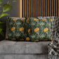 Decorative pillows with floral pattern on a gray sofa