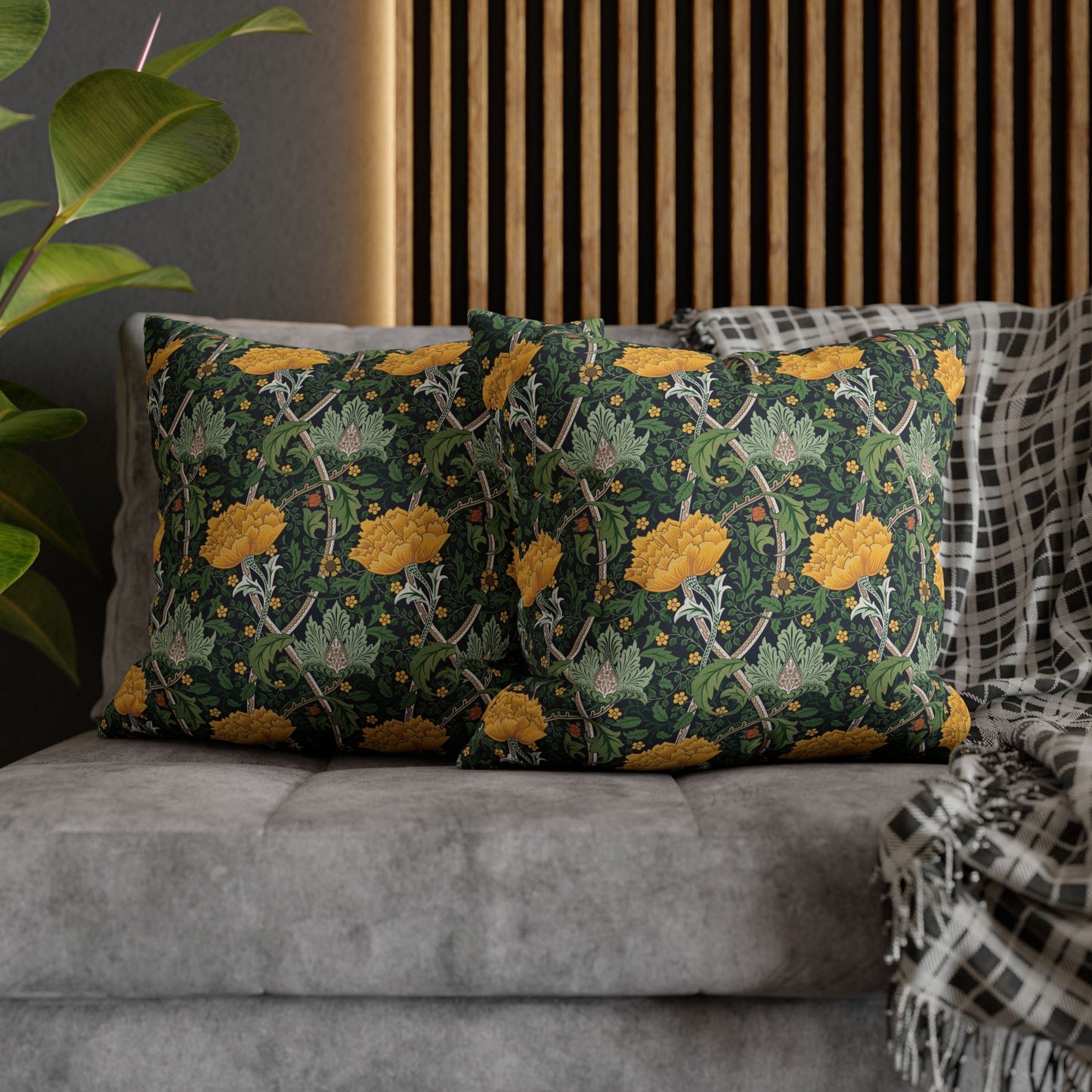 Decorative pillows with floral pattern on a gray sofa
