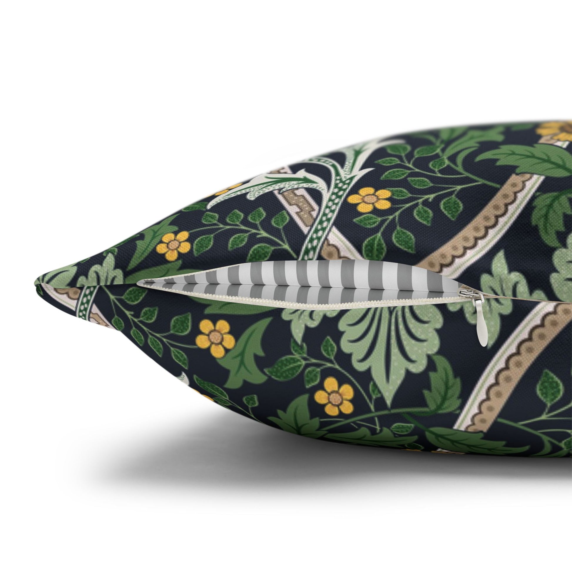 Decorative pillow with floral and leaf pattern on a white background