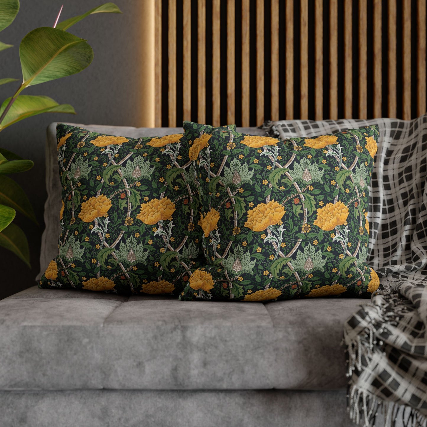 Decorative pillows with floral pattern on a gray sofa