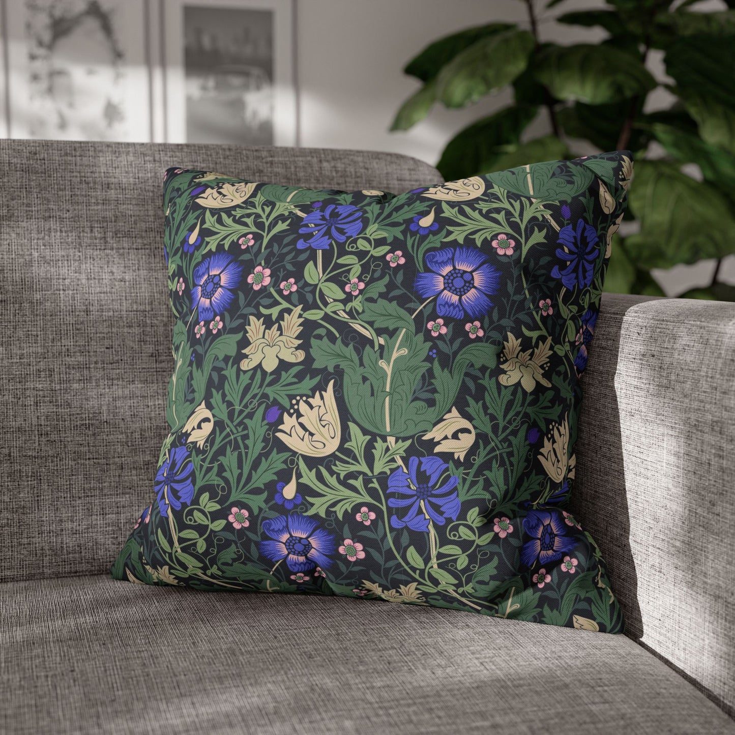 Decorative pillow with floral pattern on a gray sofa