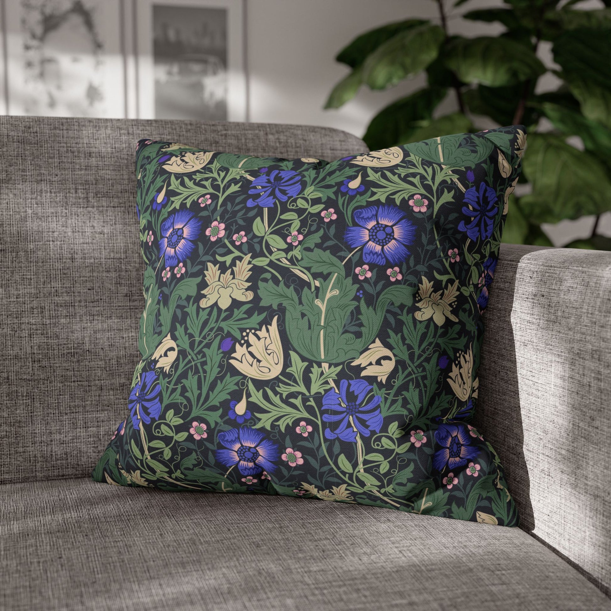 Decorative pillow with floral pattern on a gray sofa