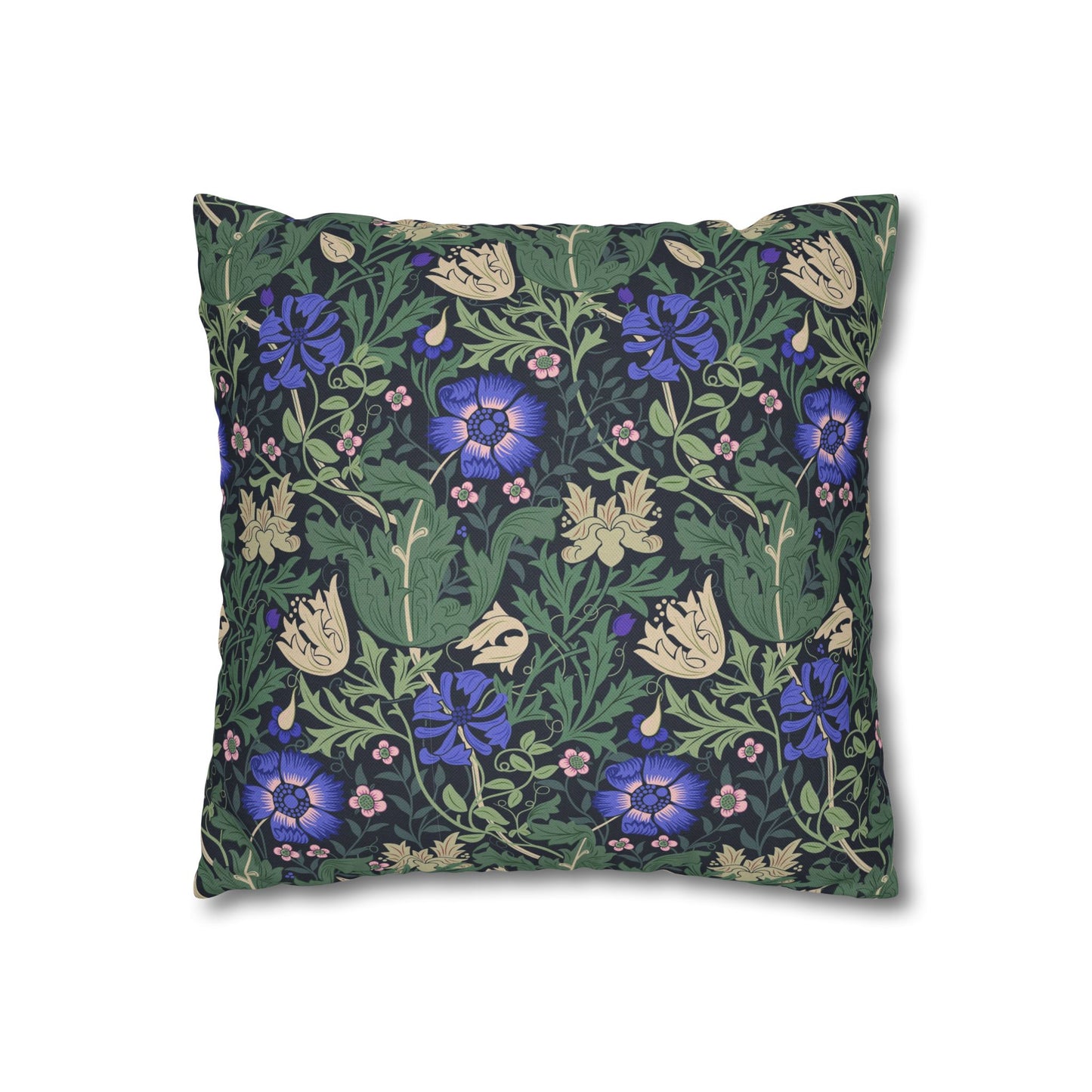 Floral patterned pillow with blue flowers on a green background