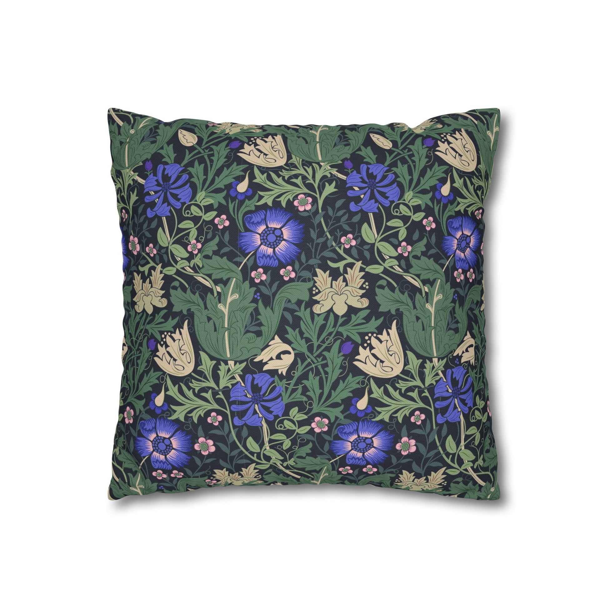Floral patterned pillow with blue flowers on a green background