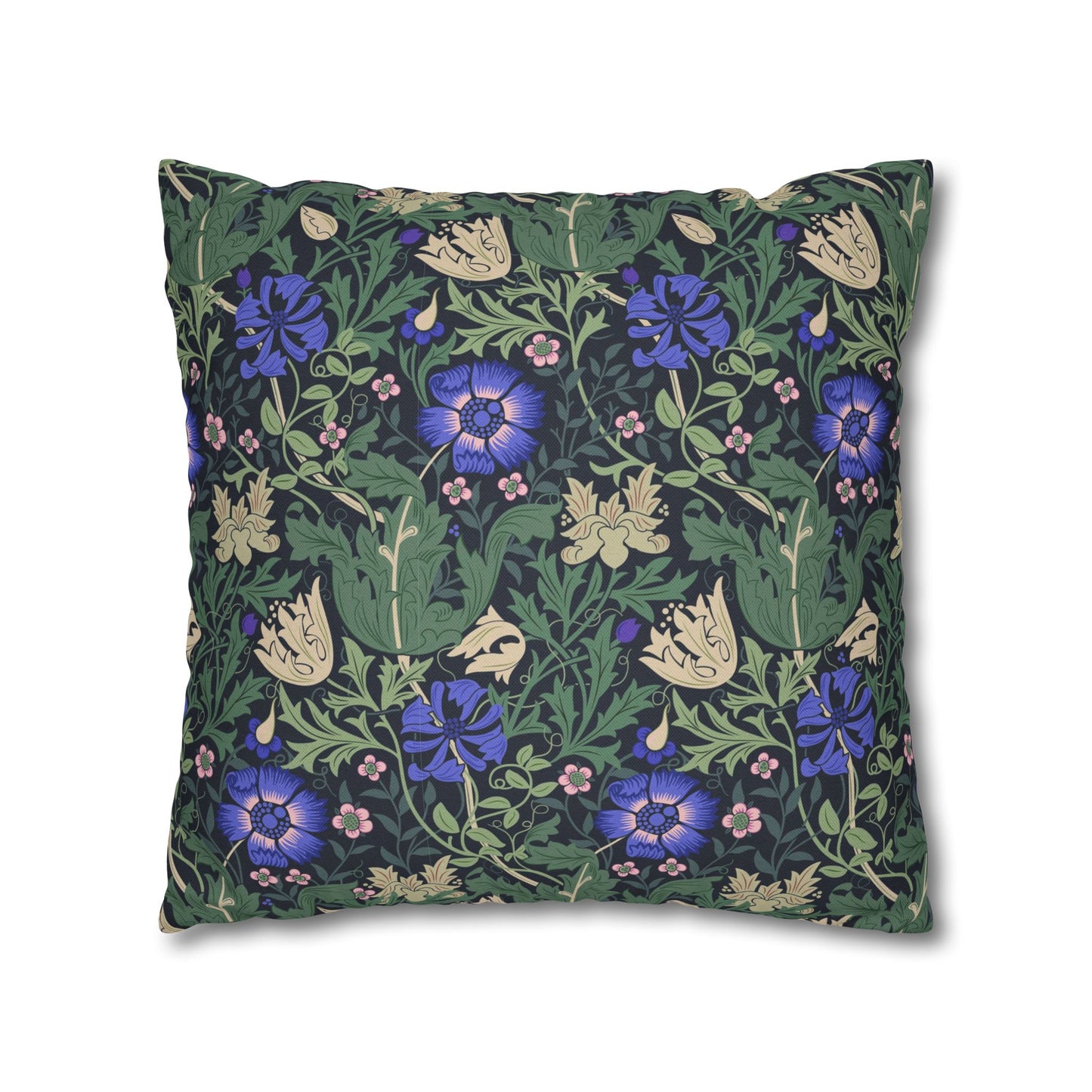 Floral patterned pillow with blue flowers on a green background