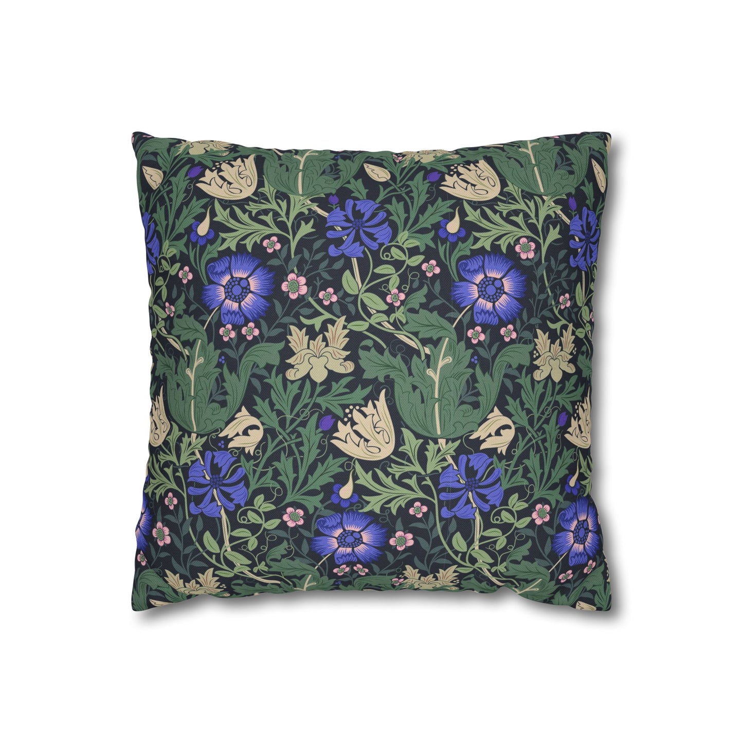 Floral patterned pillow with blue flowers on a green background