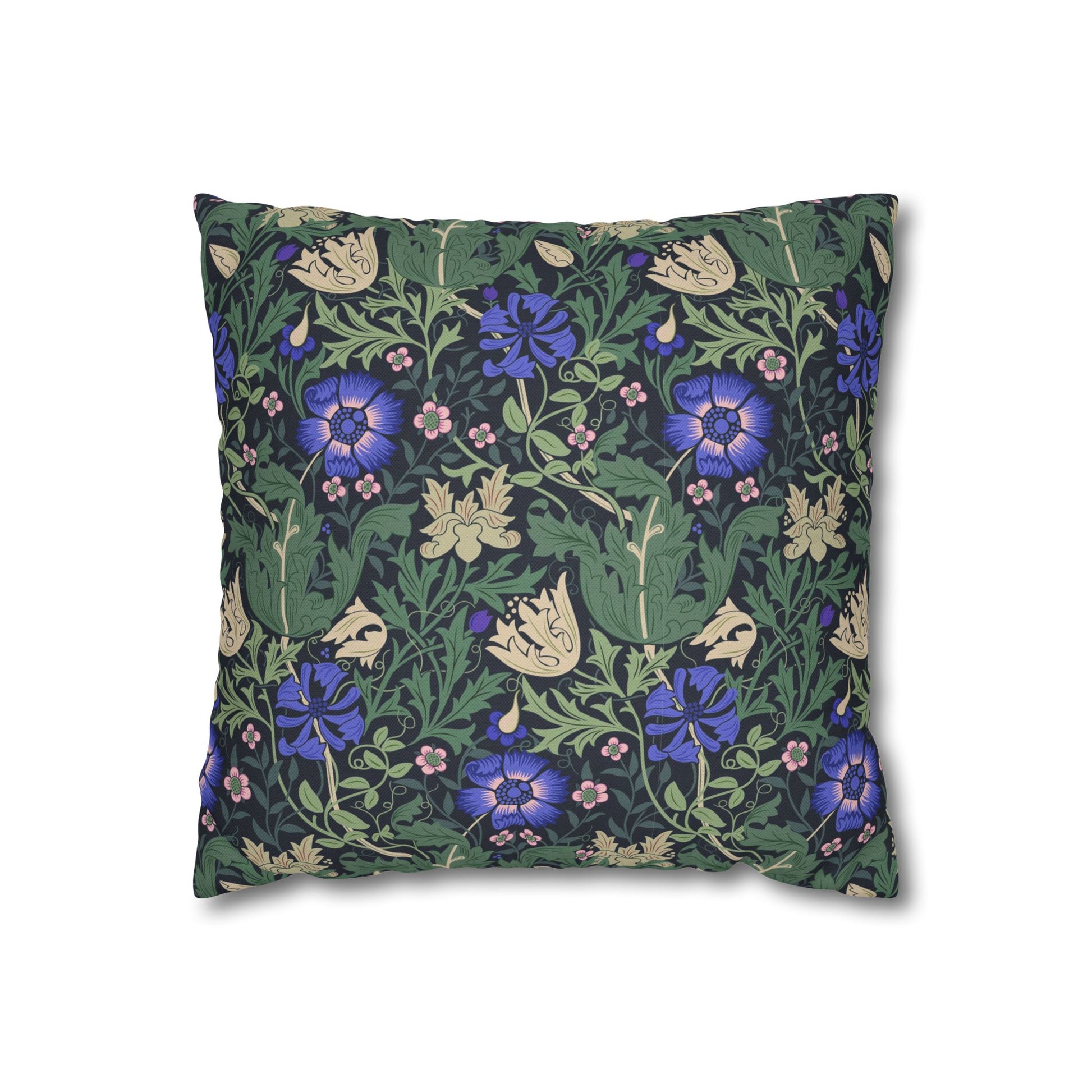 Floral patterned pillow with blue flowers on a green background
