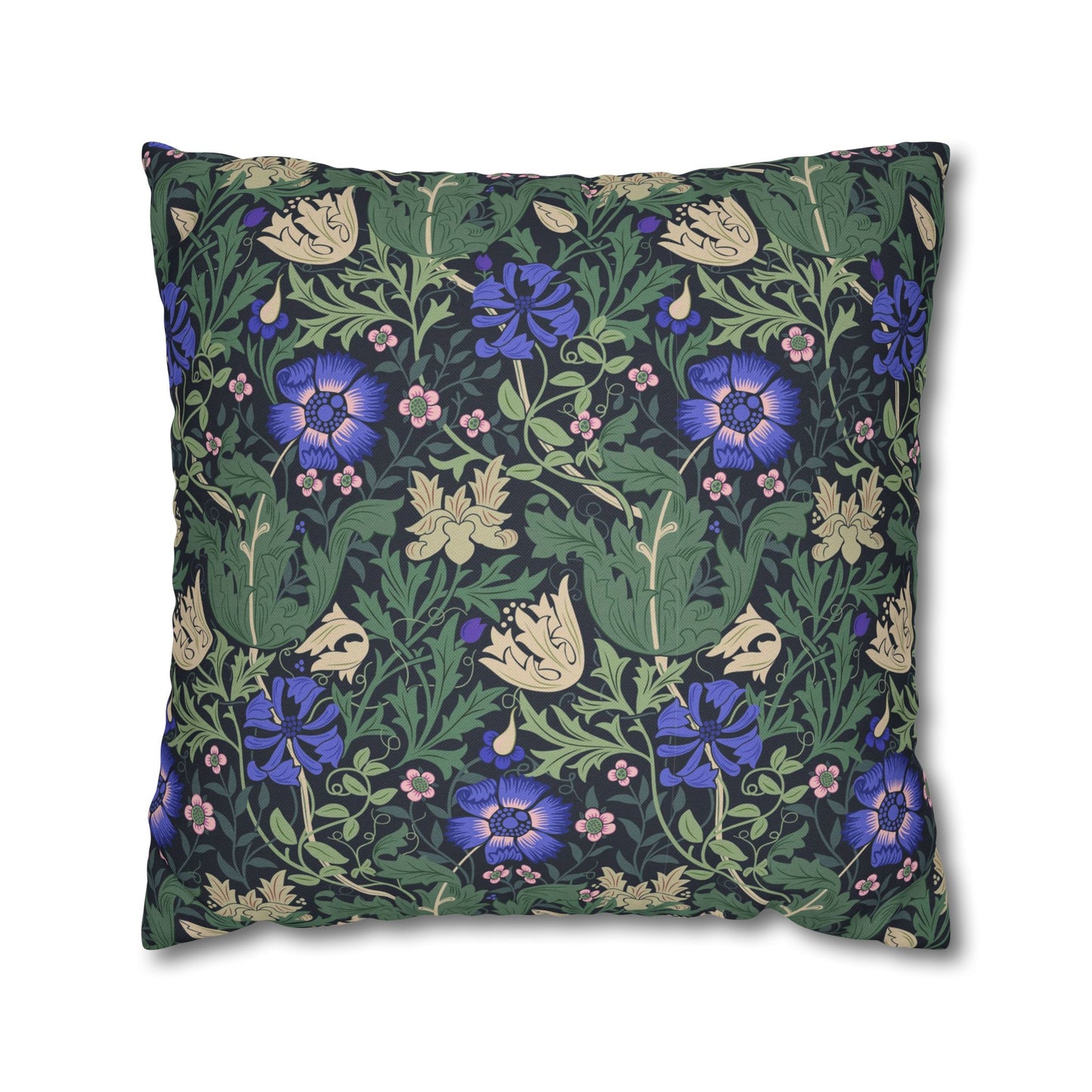 Floral patterned pillow with blue flowers and green leaves on a white background
