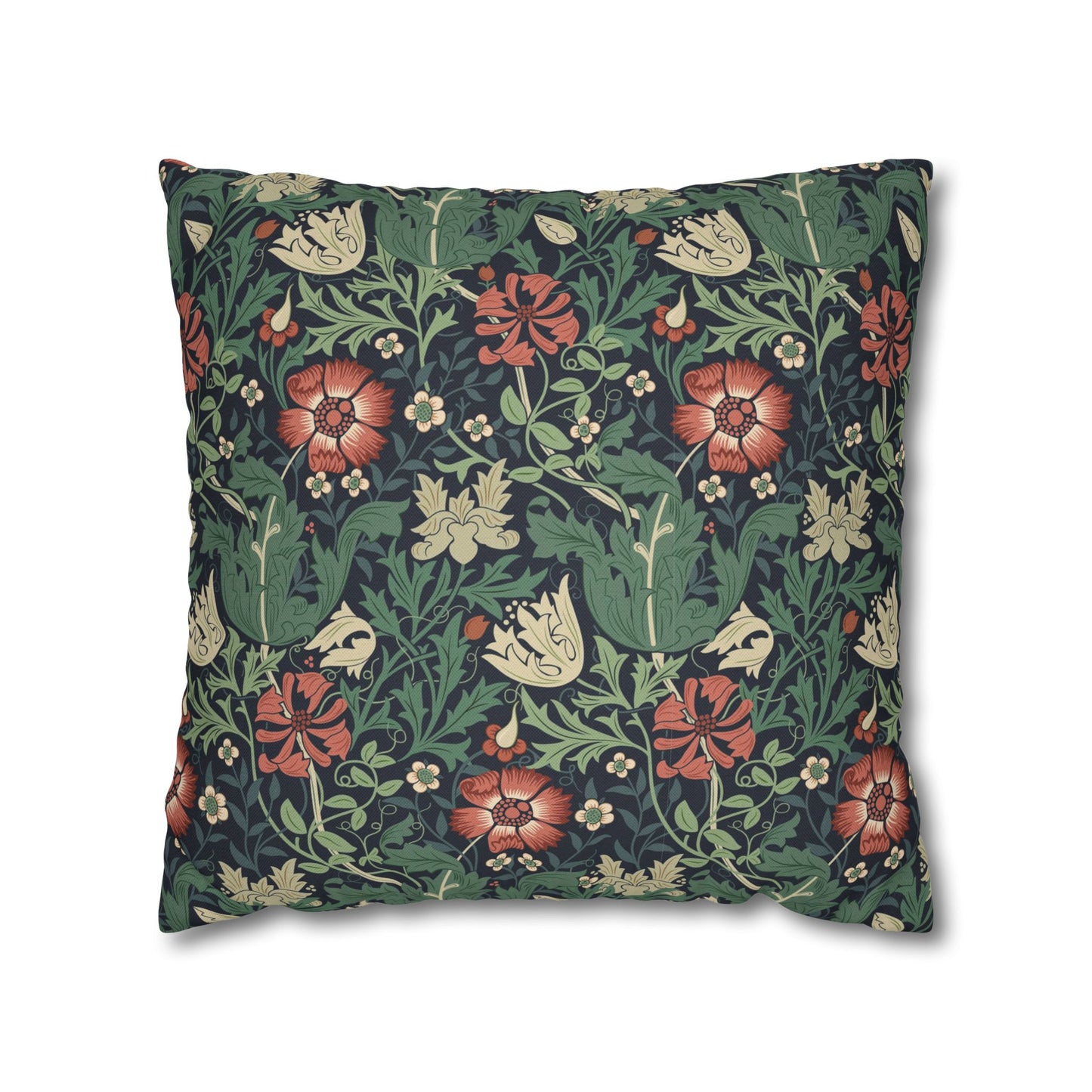 Floral patterned pillow with red and green design on a white background