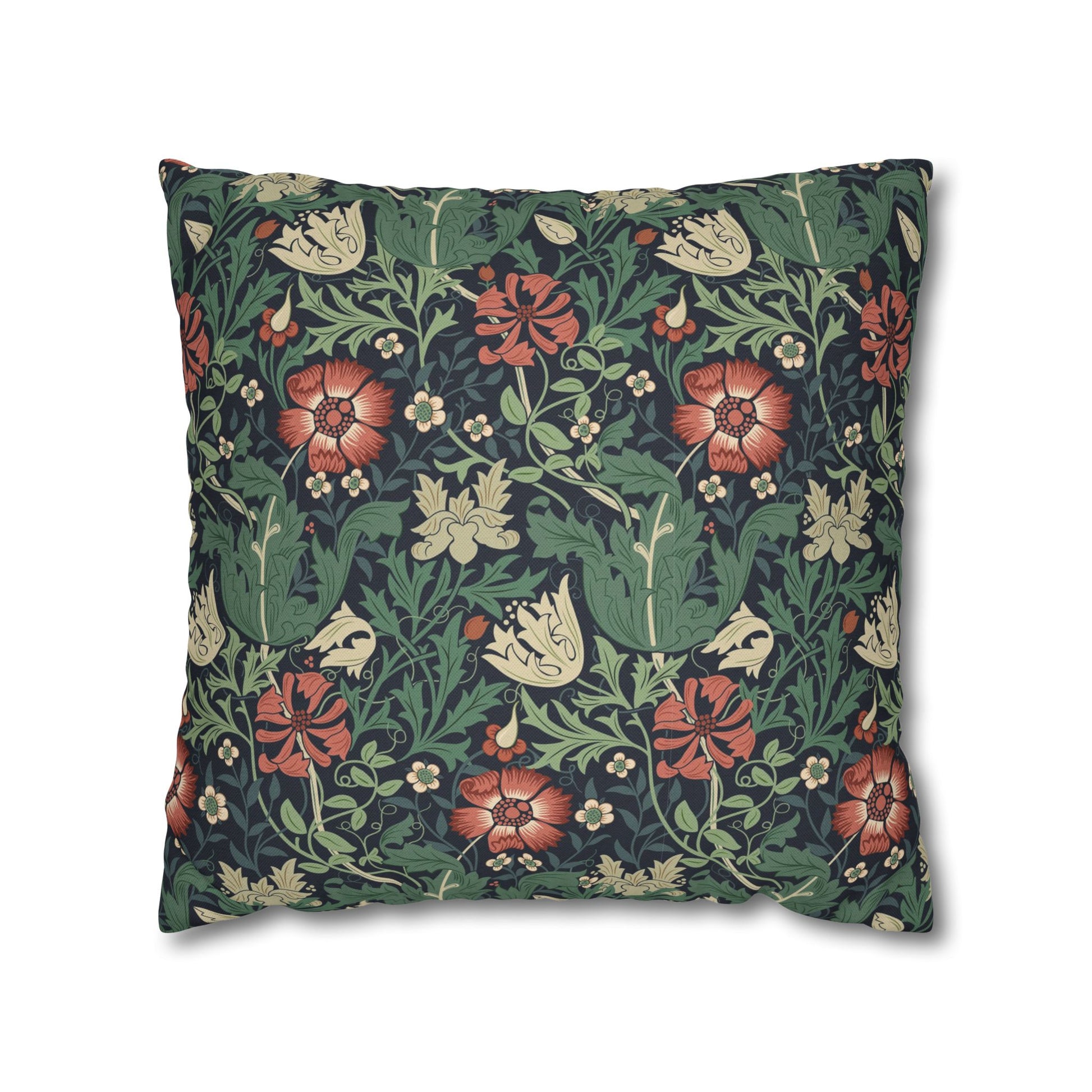 Floral patterned pillow with red and green design on a white background