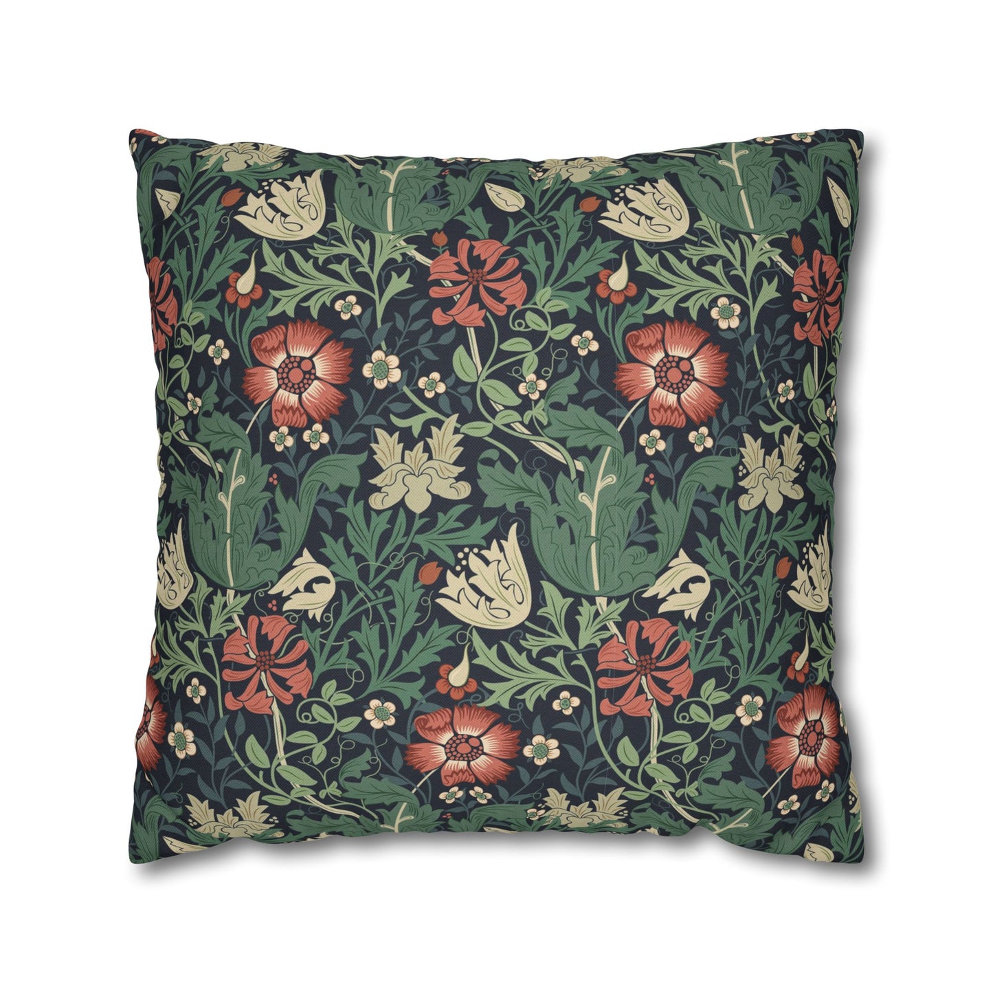 Floral patterned pillow with red flowers and green leaves on a dark background