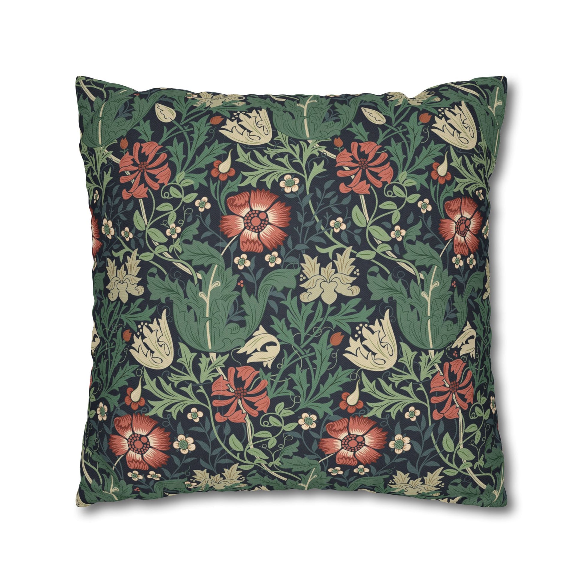 Floral patterned pillow with red, green, and beige flowers on a dark background