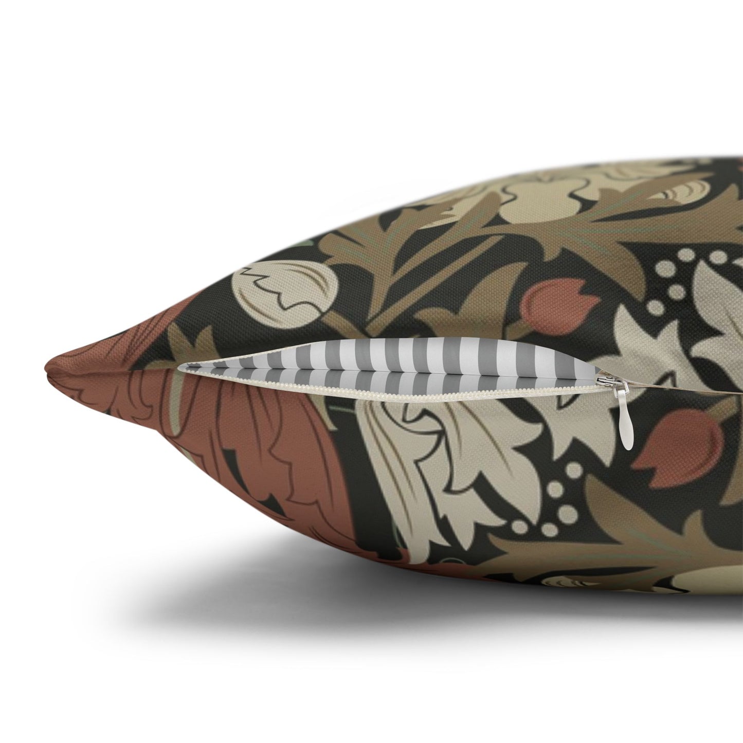 Decorative pillow with intricate pattern and zipper on a white background