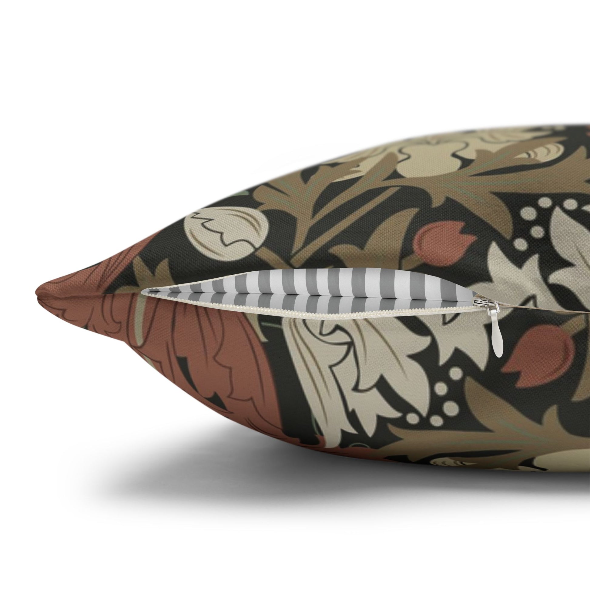 Decorative pillow with intricate pattern and zipper on a white background