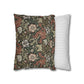 Decorative pillow with floral pattern next to a striped pillow on a white background