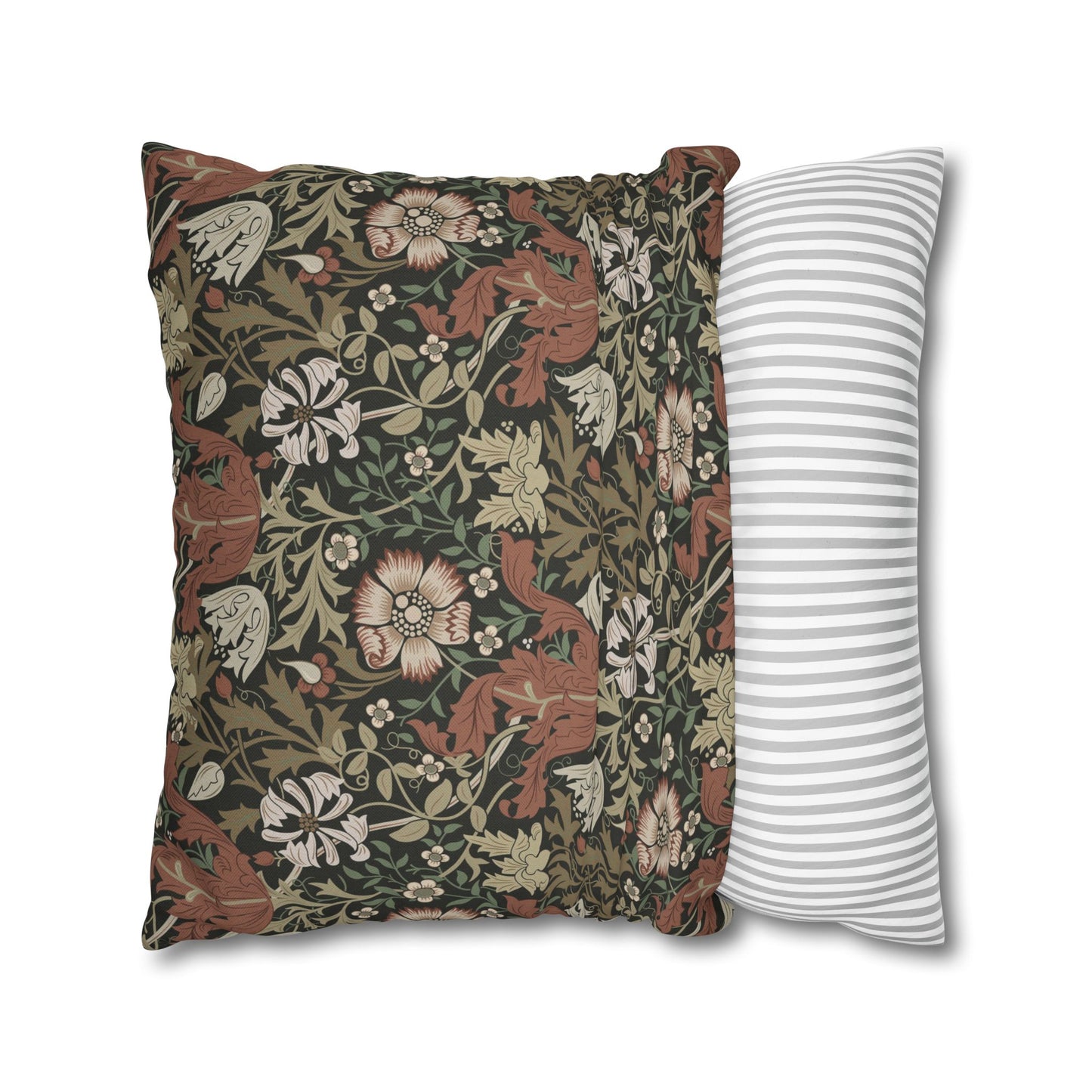 Two pillows, one with floral pattern and one with stripes, on a white background