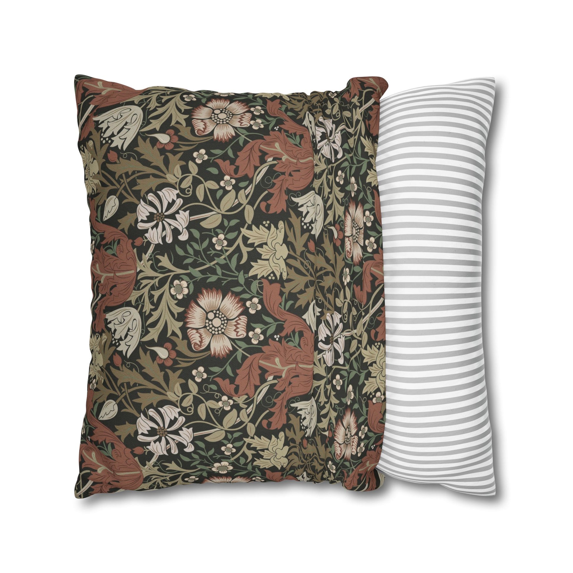 Two pillows, one with floral pattern and one with stripes, on a white background