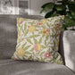 Decorative pillow with floral pattern on a gray sofa