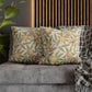 Decorative pillows with face patterns on a sofa