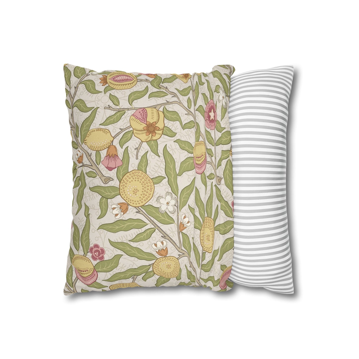 Decorative pillow with floral pattern next to a striped pillow on a white background