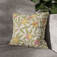 Decorative pillow with floral pattern on a gray sofa