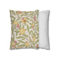 Two pillows, one with floral pattern and one with stripes, on a white background