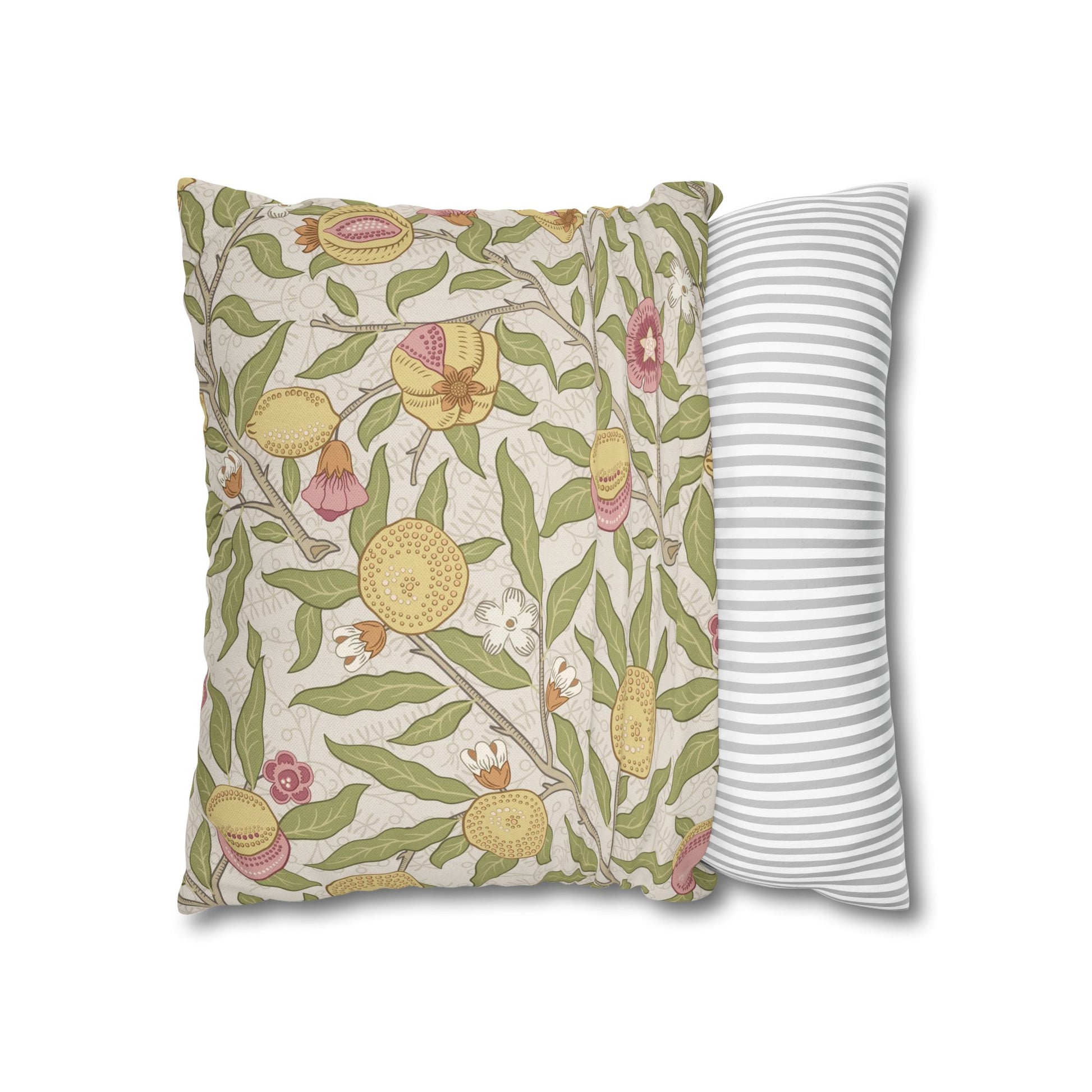 Two pillows, one with floral pattern and one with stripes, on a white background