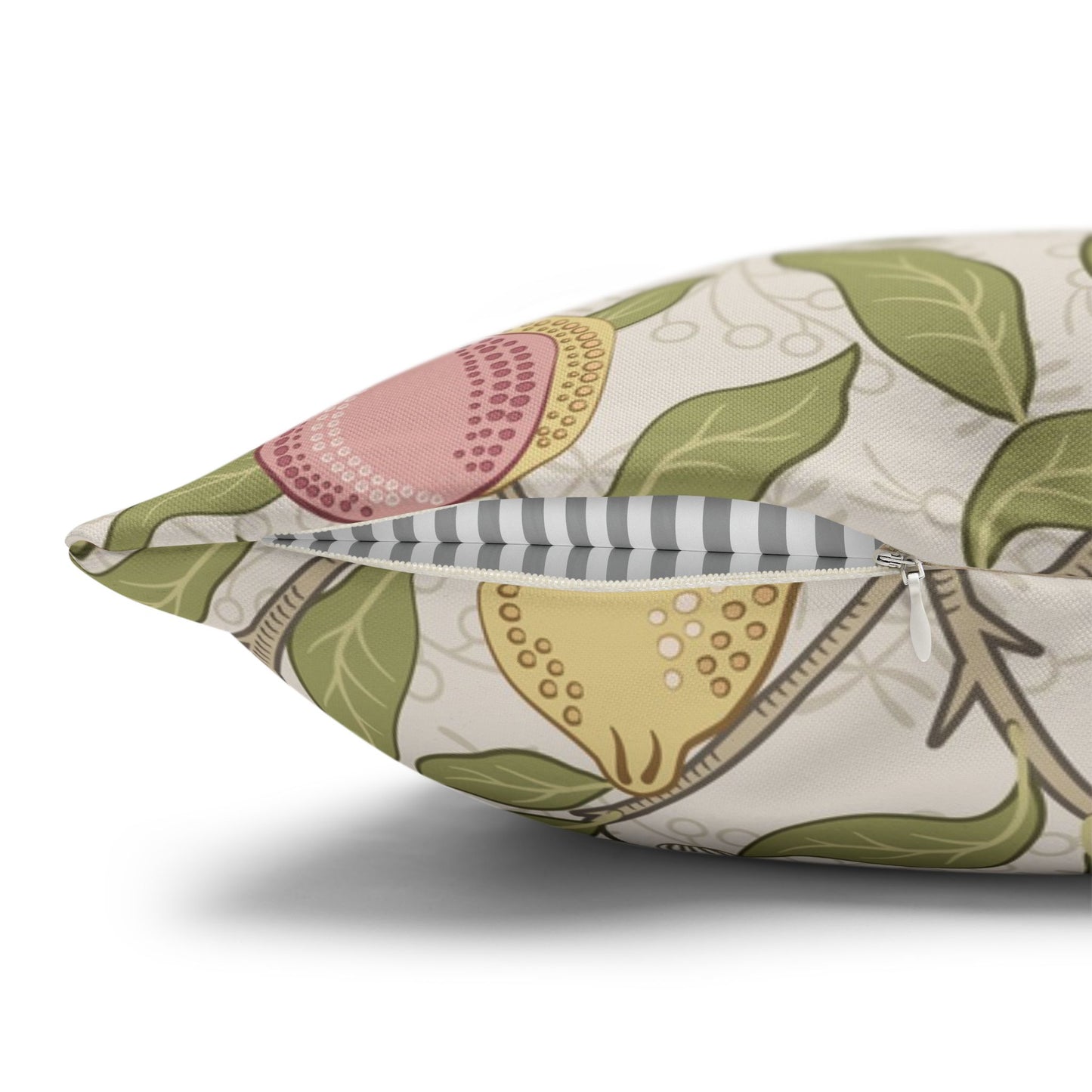 Decorative pillow with fruit and leaf pattern on a white background