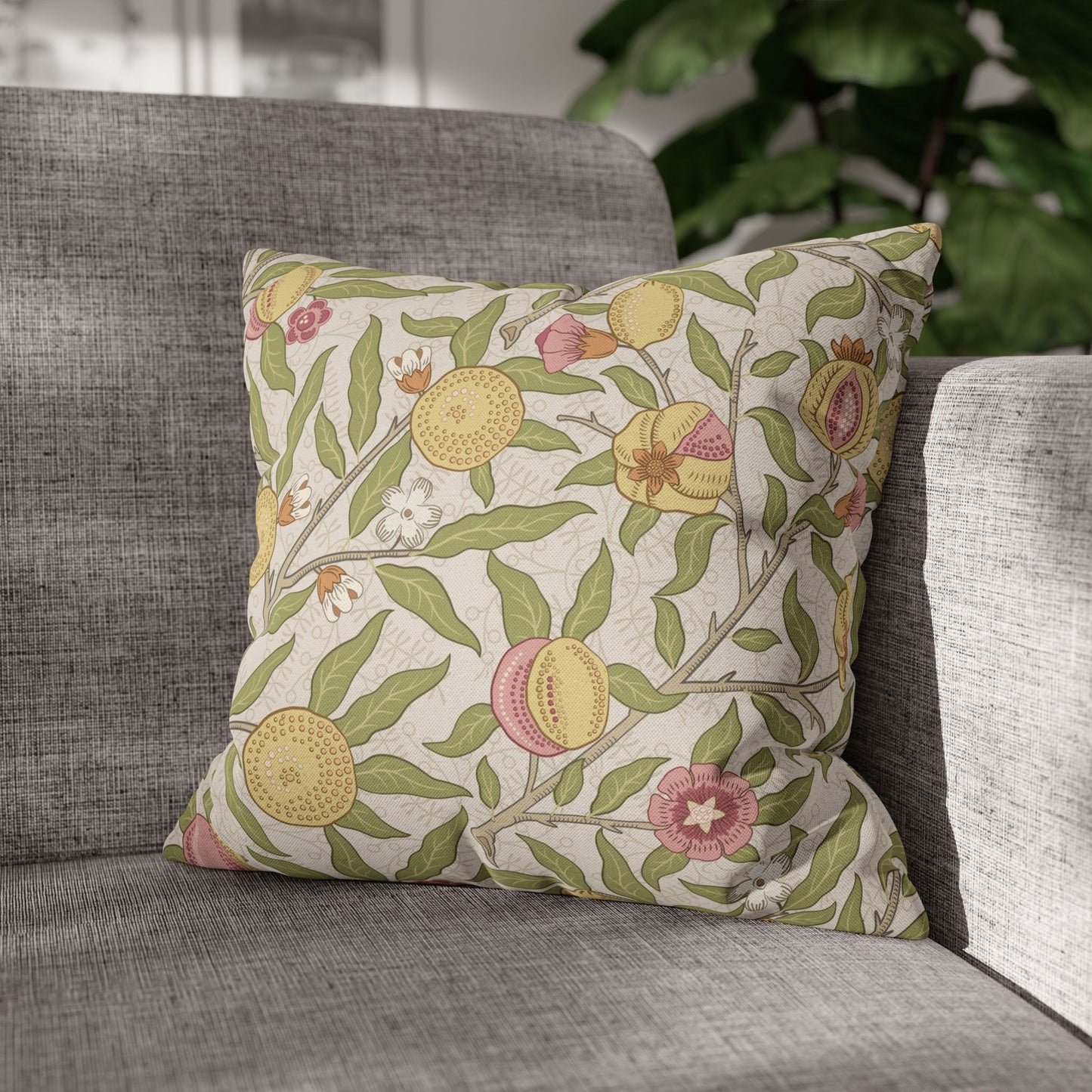 Decorative pillow with floral pattern on a gray sofa