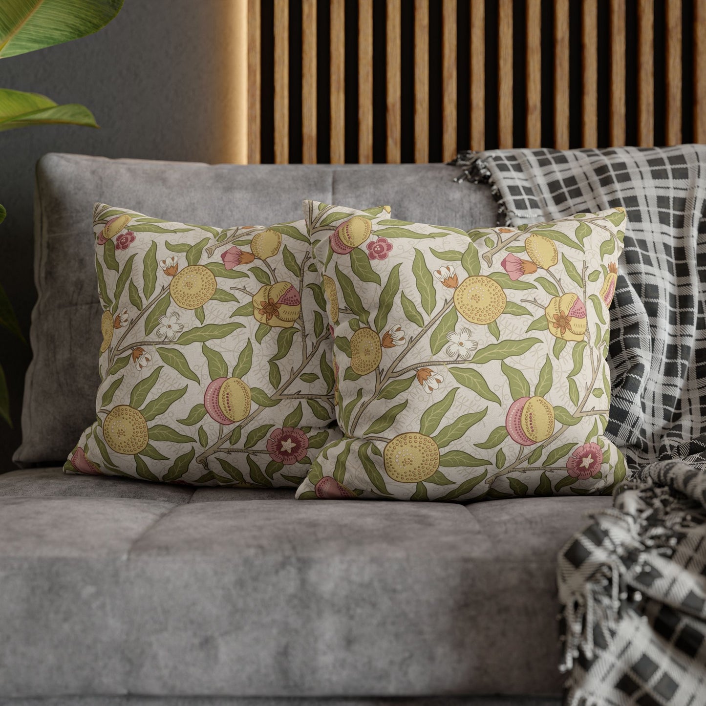 Decorative pillows with floral pattern on a gray sofa