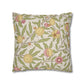 Decorative pillow with floral and fruit pattern on a white background