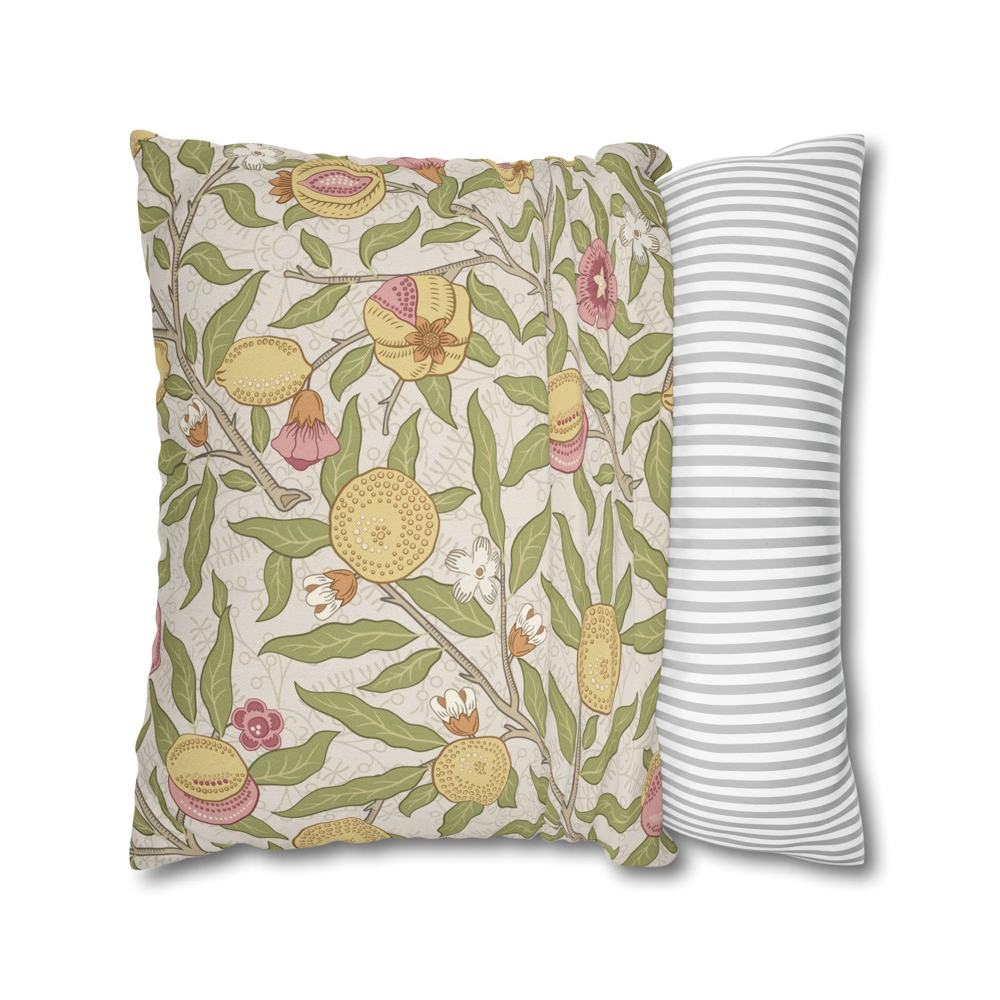Two pillows, one with floral pattern and one with stripes, on a white background