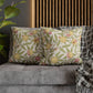 Decorative pillows with face patterns on a sofa