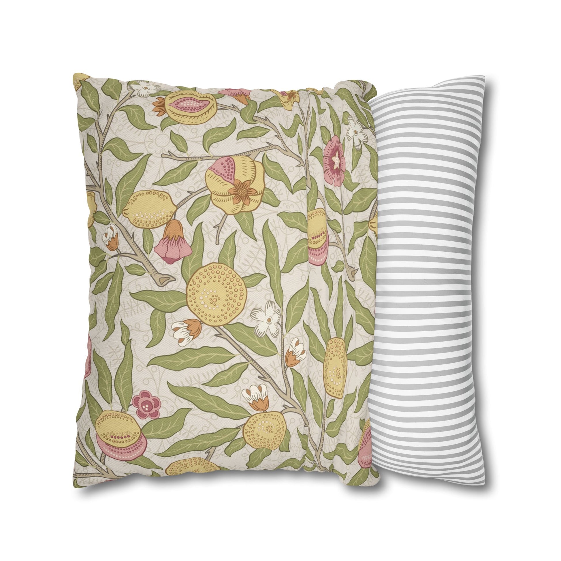 Two pillows, one with floral pattern and one with stripes, on a white background