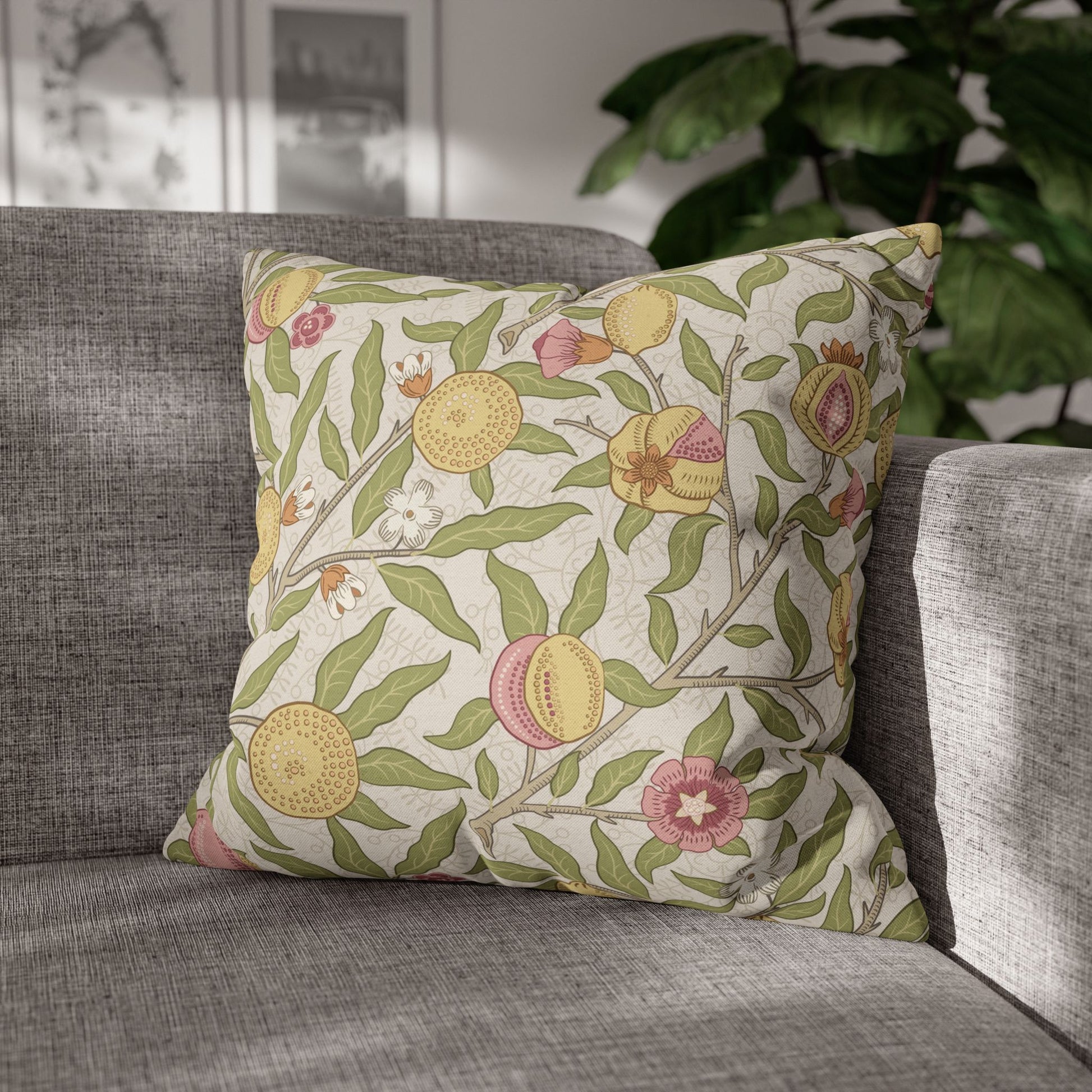 Decorative pillow with floral pattern on a gray sofa