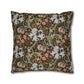 Decorative pillow with floral and paisley pattern on a dark background