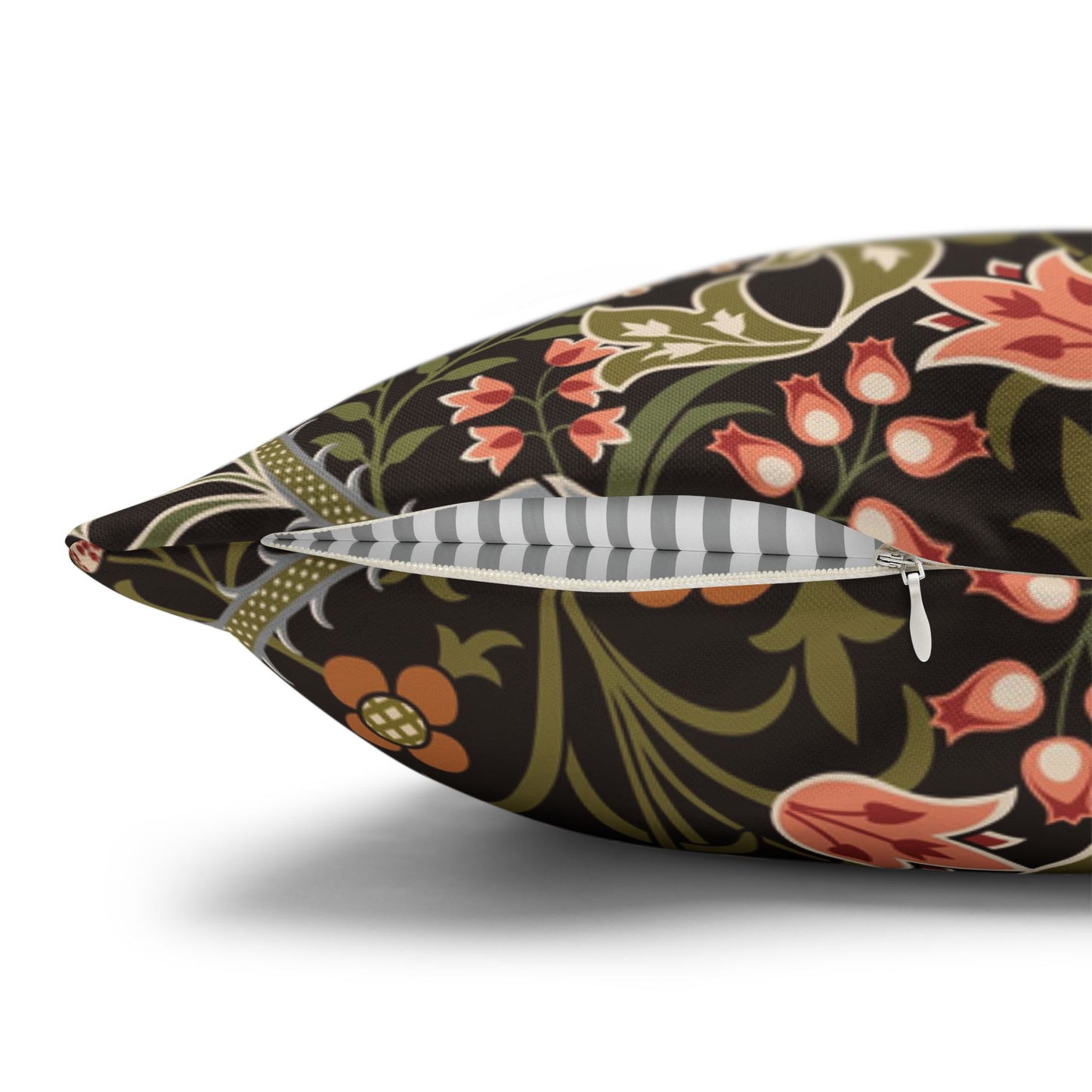 Decorative pillow with floral pattern and zipper on a white background
