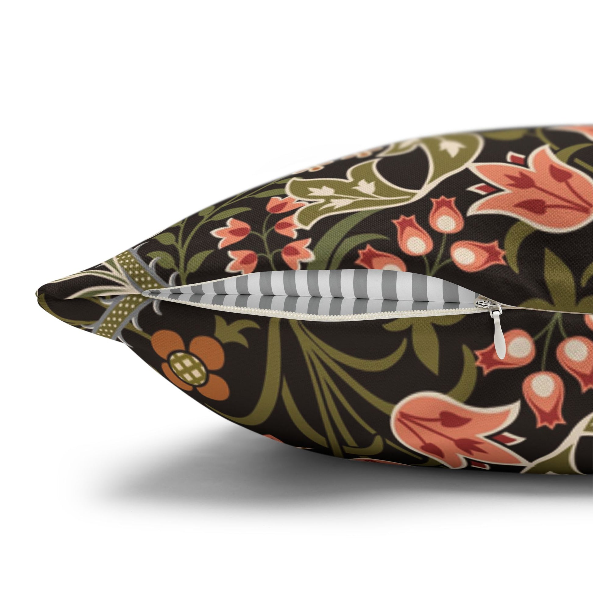 Floral-patterned pillow with a zipper on a white background