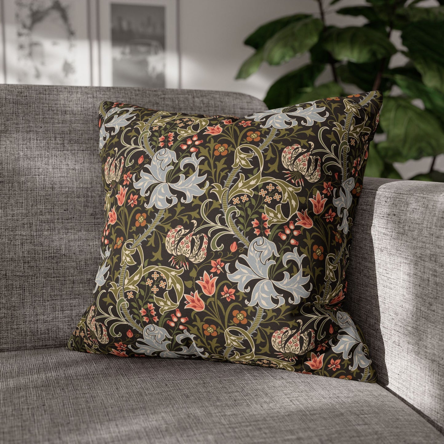 Decorative pillow with floral pattern on a gray sofa
