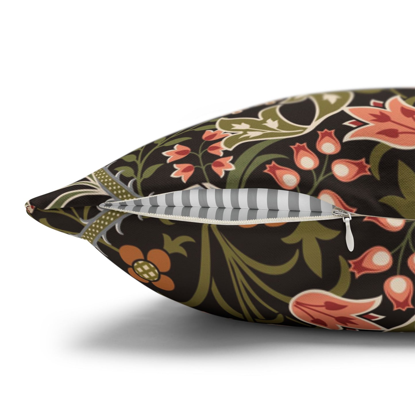Floral-patterned pillow with a zipper on a white background