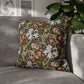 Decorative pillow with floral pattern on a gray sofa