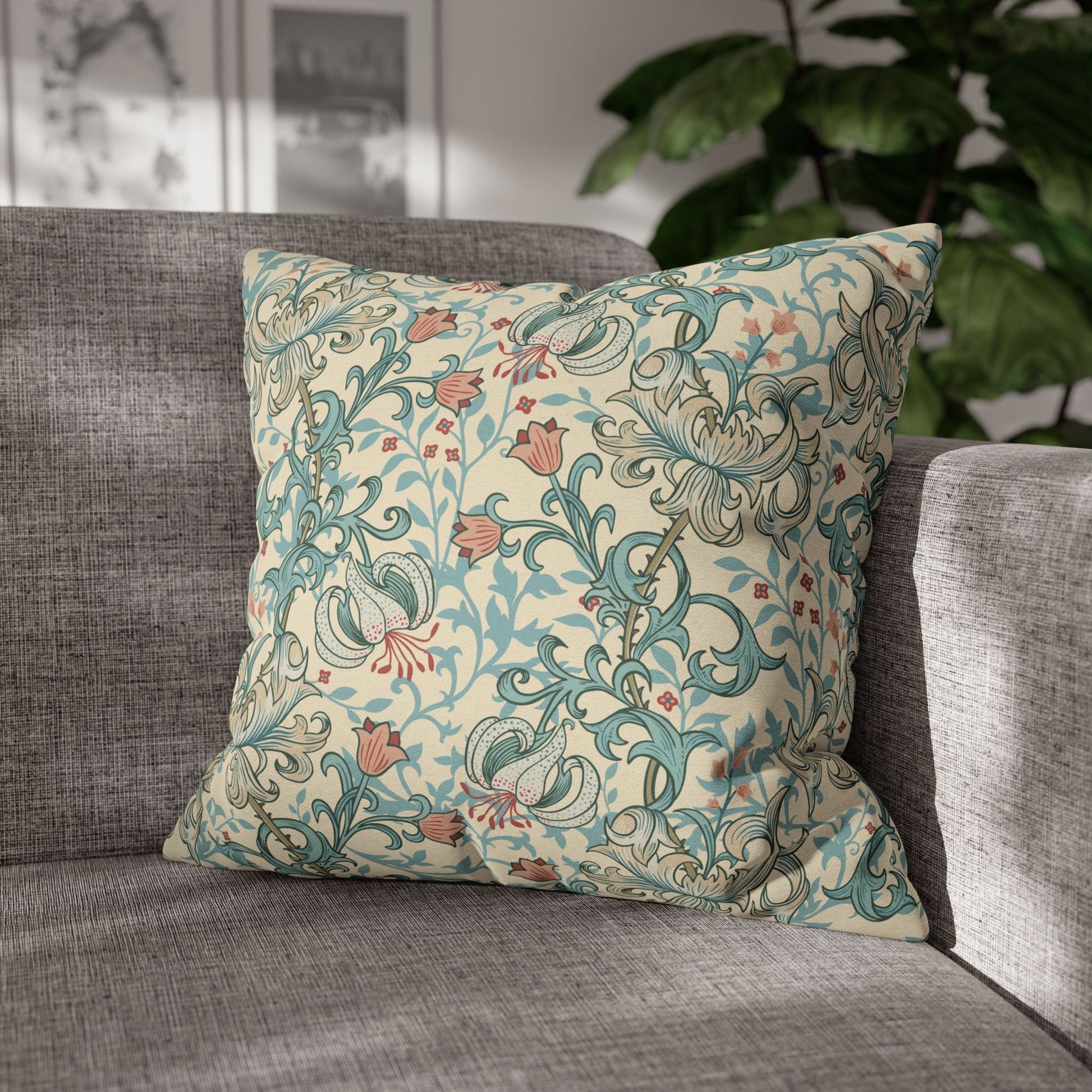 Decorative pillow with floral pattern on a gray sofa