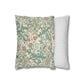 Two pillows, one with floral pattern and one with stripes, on a white background