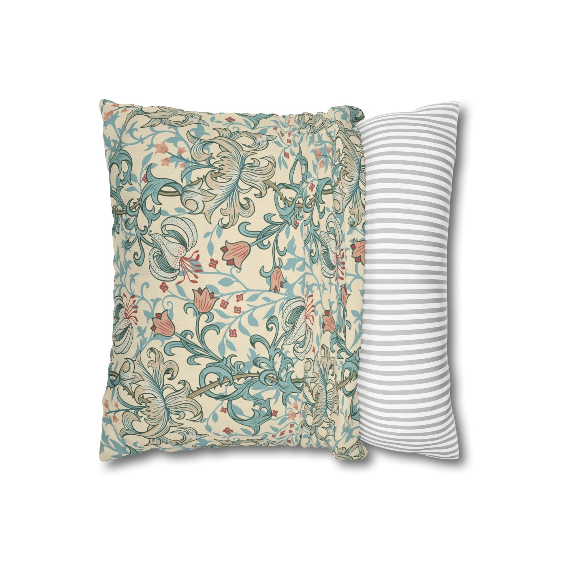 Two pillows, one with floral pattern and one with stripes, on a white background