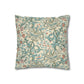 Decorative pillow with intricate floral pattern on a beige background