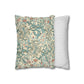 Decorative pillow with floral pattern next to a striped pillow on a white background