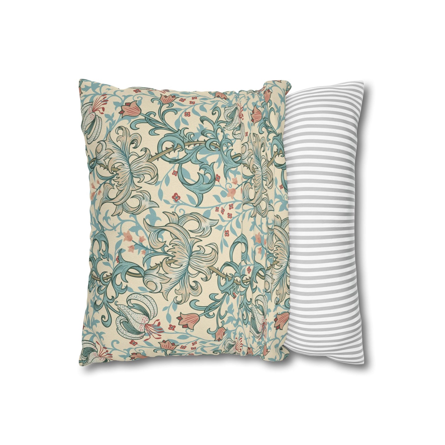 Decorative pillow with floral pattern next to a striped pillow on a white background